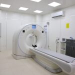A state-of-the-art diagnostic imaging room featuring a CT scanner and medical equipment