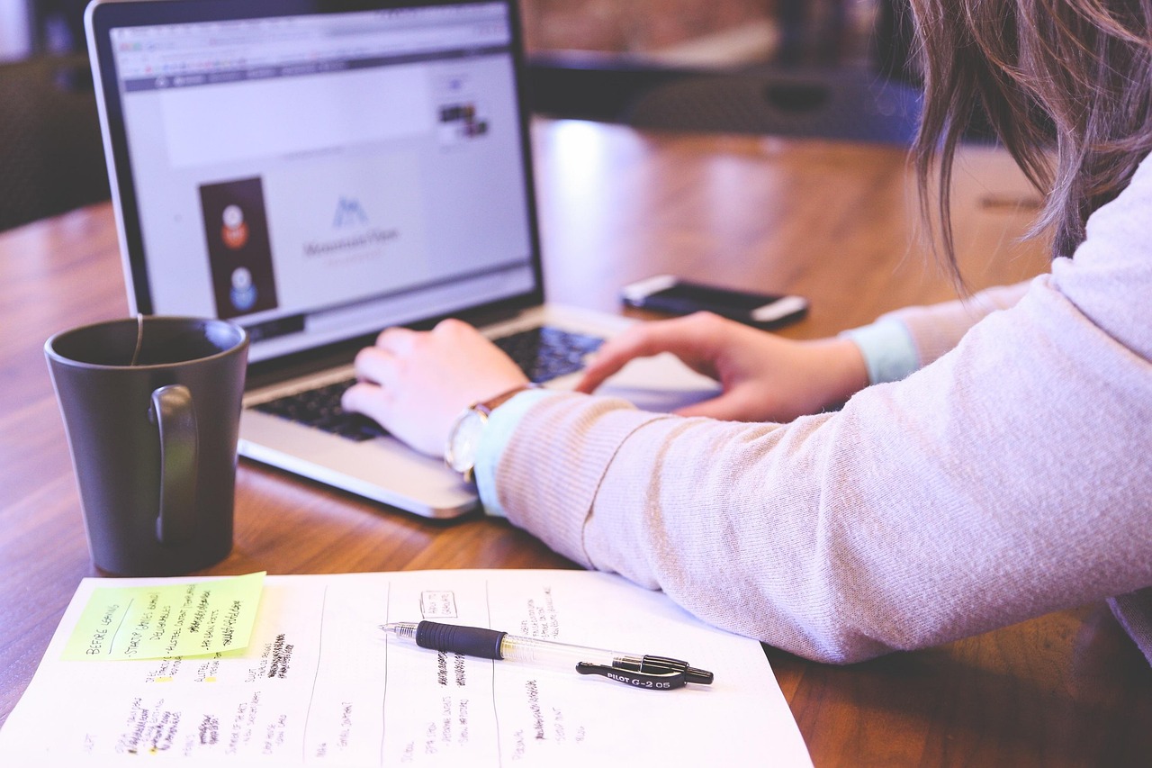 Student, typing, keyboard — Website Design and Development Agency for Seamless Digital Experiences